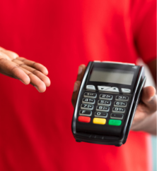 closeup view of black man holding pos machine for payment